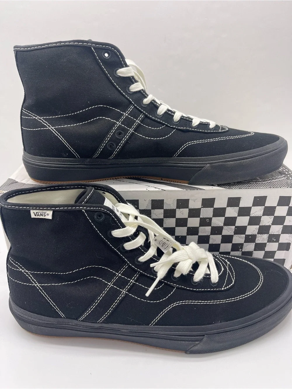 Vans Men’s High-Top Canvas Sneakers in Black and White